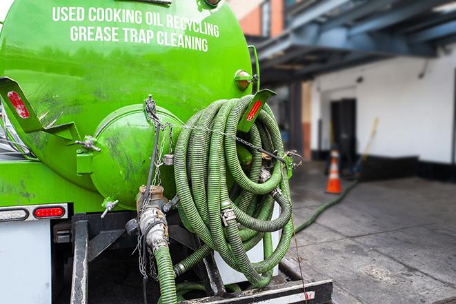 pumping out a heavy-duty grease trap at a restaurant in Dinuba